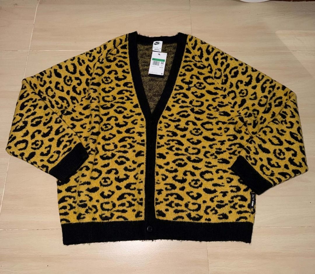 Nike Leopard Print Cardigan Sweater (Category: Coats, Jackets and Outerwear) located in Cainta. Submitted by hermosooo (Listing ID 1460714235, Image 1). Description: - Eye-catching yellow and black leopard print - Cozy, fuzzy material - Stylish black trim and cuffs - Functional front button closure - Estimated size: Medium (M) - Perfect statement piece to elevate your style.