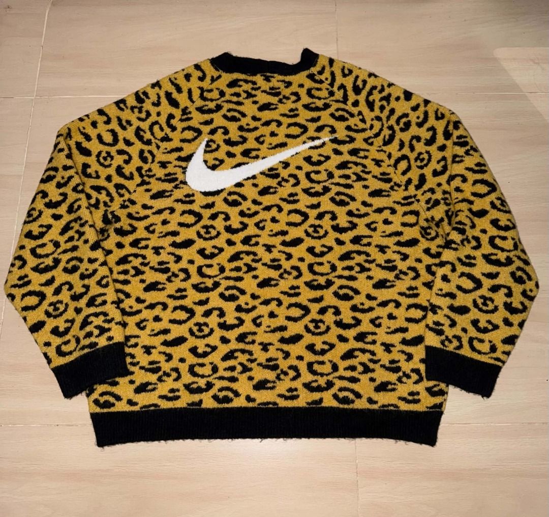 Nike Leopard Print Cardigan Sweater (Category: Coats, Jackets and Outerwear) located in Cainta. Submitted by hermosooo (Listing ID 1460714235, Image 2). Description: - Eye-catching yellow and black leopard print - Cozy, fuzzy material - Stylish black trim and cuffs - Functional front button closure - Estimated size: Medium (M) - Perfect statement piece to elevate your style.
