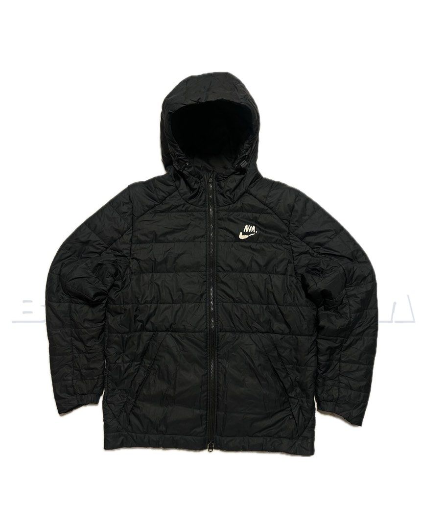 Nike Padded Hooded Jacket Black (Category: Coats, Jackets and Outerwear) located in Santa Rosa. Submitted by vardo.blvnt (Listing ID 1460523626, Image 1). Description: - Black Nike puffer jacket - Features a hood - Full zip closure - Lightweight yet warm, perfect for cooler weather - Classic, simple design - Nike logo prominently displayed on the chest.