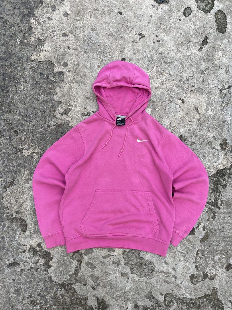 Nike Pink Hoodie (Category: Coats, Jackets and Outerwear) located in Cavite. Submitted by vlblgrmnts_ (Listing ID 1460627613, Image 3). Description: - Classic Nike hoodie in a vibrant bright pink. - Features the iconic embroidered Nike swoosh logo on the chest. - Includes a convenient front kangaroo pocket. - Adjustable drawstring hood for a customizable fit. - Ideal for everyday casual wear or active workouts. - Offers both comfort and style. Ni