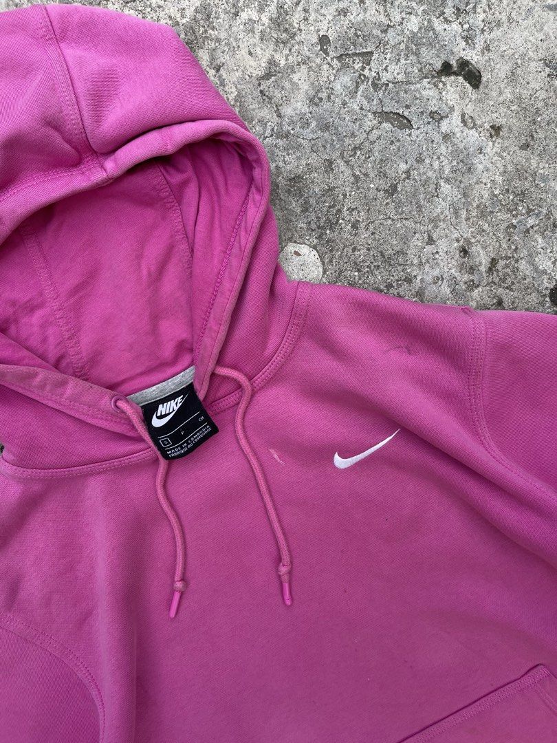 Nike Pink Hoodie (Category: Coats, Jackets and Outerwear) located in Cavite. Submitted by vlblgrmnts_ (Listing ID 1460627613, Image 2). Description: - Classic Nike hoodie in a vibrant bright pink. - Features the iconic embroidered Nike swoosh logo on the chest. - Includes a convenient front kangaroo pocket. - Adjustable drawstring hood for a customizable fit. - Ideal for everyday casual wear or active workouts. - Offers both comfort and style. Ni