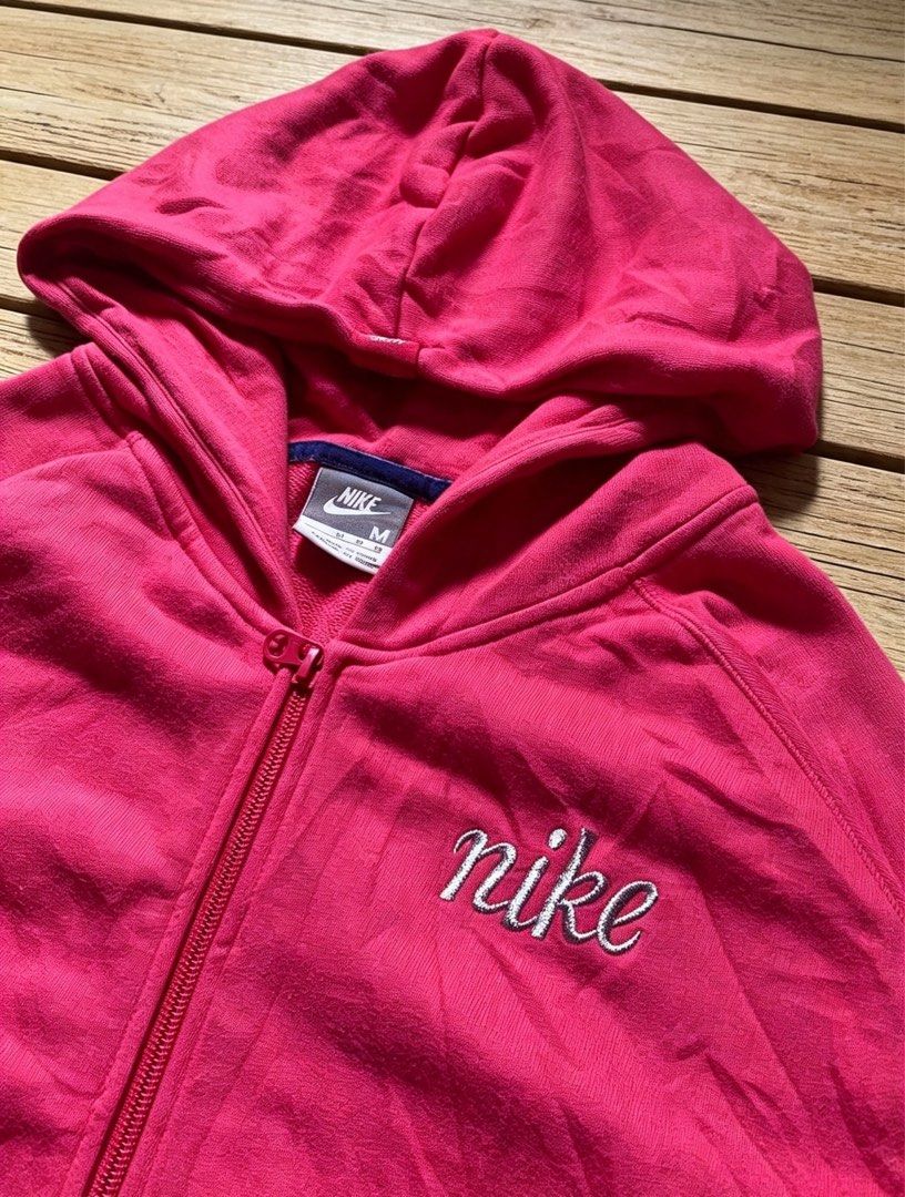 Nike Pink Zip-Up Hoodie Jacket (Category: Coats, Jackets and Outerwear) located in Manila. Submitted by tygaangub1096 (Listing ID 1460653075, Image 3). Description: - Pink Nike Zip-Up Hoodie - Size: Medium (M) - 19 width 24 length - Classic embroidered Nike logo on chest - Two functional front pockets - Ideal for casual wear or workouts - Comfortable and stylish design - Add shipping fee.