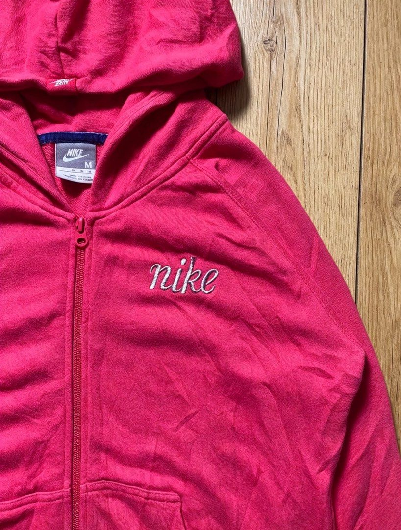 Nike Pink Zip-Up Hoodie Jacket (Category: Coats, Jackets and Outerwear) located in Manila. Submitted by tygaangub1096 (Listing ID 1460653075, Image 2). Description: - Pink Nike Zip-Up Hoodie - Size: Medium (M) - 19 width 24 length - Classic embroidered Nike logo on chest - Two functional front pockets - Ideal for casual wear or workouts - Comfortable and stylish design - Add shipping fee.