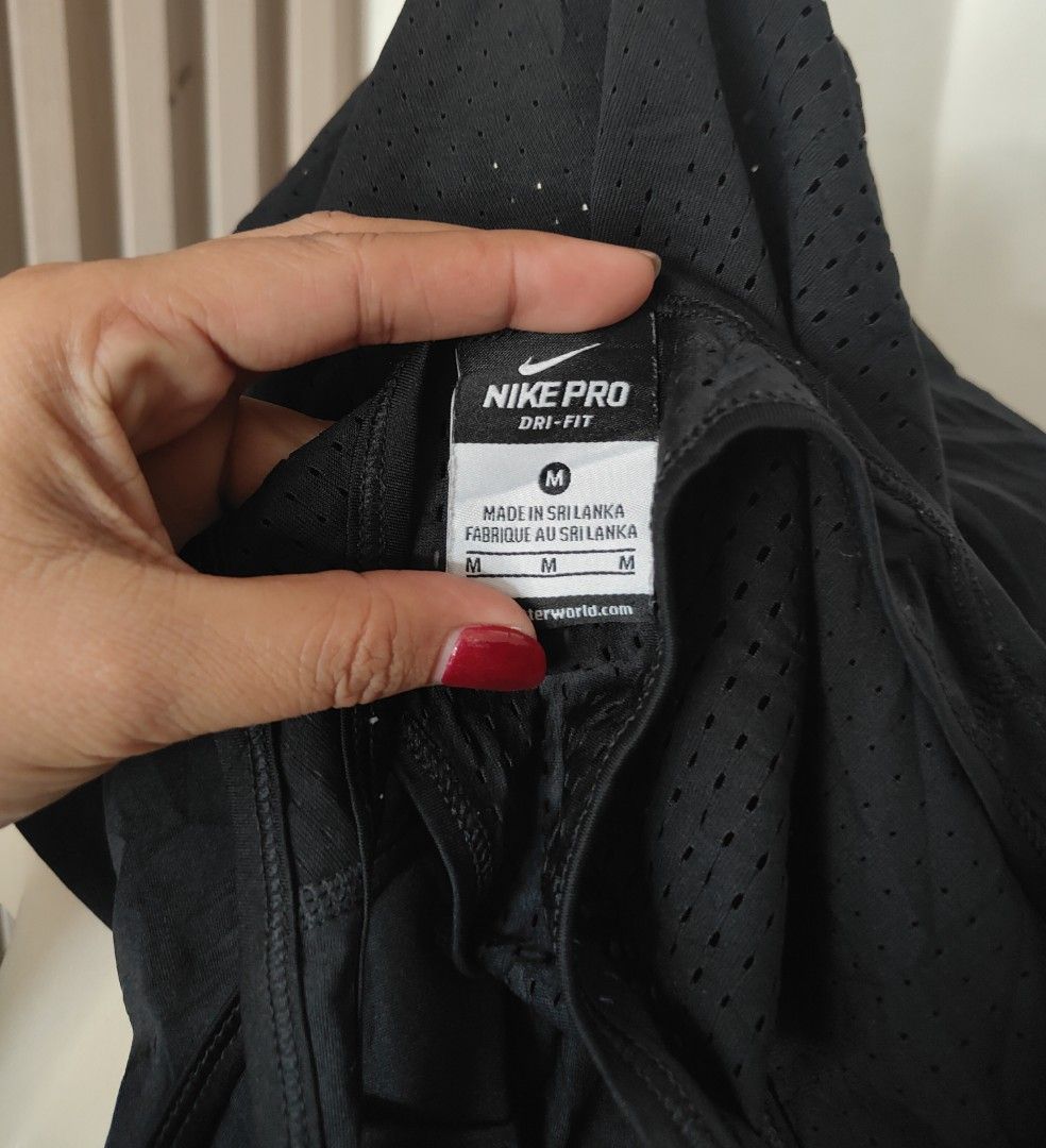 Nike Pro Dri-Fit Black Racerback Tank Top Medium (Category: Activewear) located in San Carlos City. Submitted by chinx008 (Listing ID 1460665803, Image 3). Description: - Black Nike Pro Dri-Fit tank top - Racerback design for full range of motion - Mesh paneling on the back for enhanced breathability - Ideal for workouts, running, and training - Size: Medium.