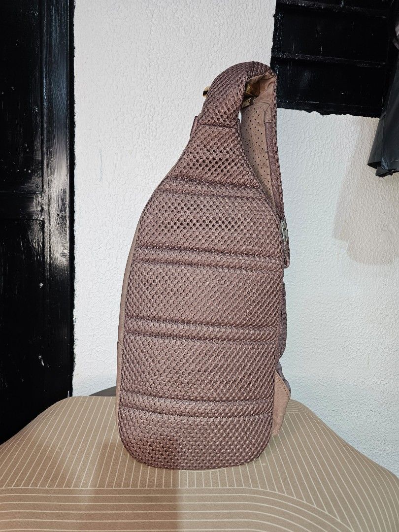 Nike Sportswear Essentials Sling Bag (Category: Luxury Bags & Wallets) located in Baguio. Submitted by kayeonlineshop (Listing ID 1460568282, Image 3). Description: Taupe-colored Nike Sportswear Essentials Sling Bag with a golden Swoosh logo and a small cord zipper pull. Measurements L-40cm W-26cm.