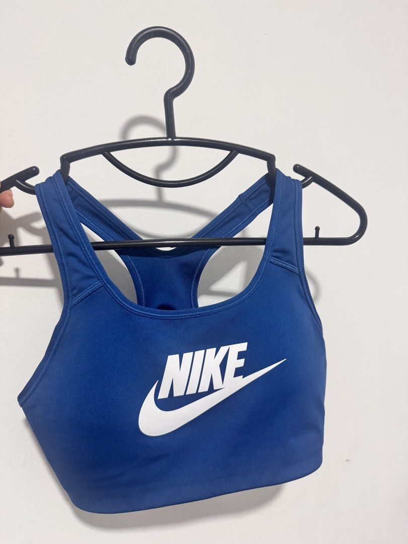Nike Swoosh Medium Support Sports Bra (Category: Activewear) located in Quezon City. Submitted by healingmyinnerchild (Listing ID 1460533785, Image 1). Description: - Royal blue Nike sports bra - Racerback design for full range of motion - Dri-Fit technology keeps you dry - Size L (75C) - Removable Pads.
