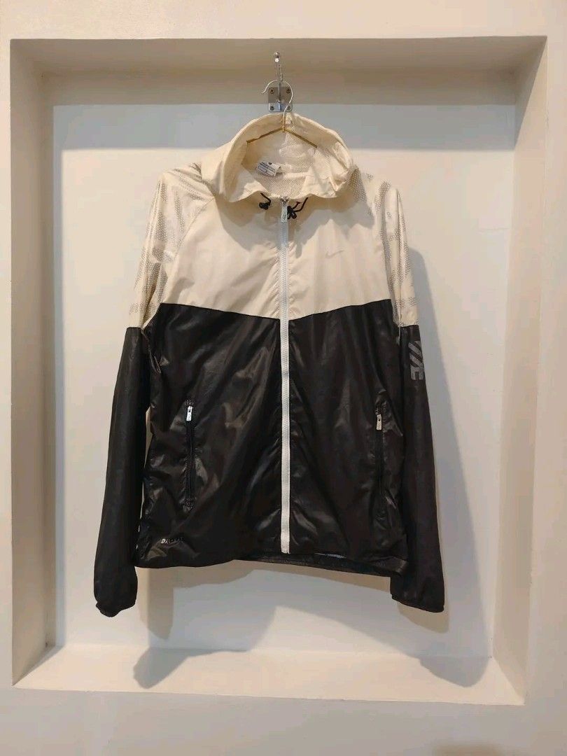 Nike Windbreaker Jacket Beige Black (Category: Coats, Jackets and Outerwear) located in Caloocan City. Submitted by clprelovedclothing (Listing ID 1460666380, Image 1). Description: - Lightweight Nike jacket - Stylish colorblocked design (beige & black) - Breathable mesh detailing on upper back & sleeves - Two secure zippered pockets - Ideal for outdoor adventures or everyday casual style.