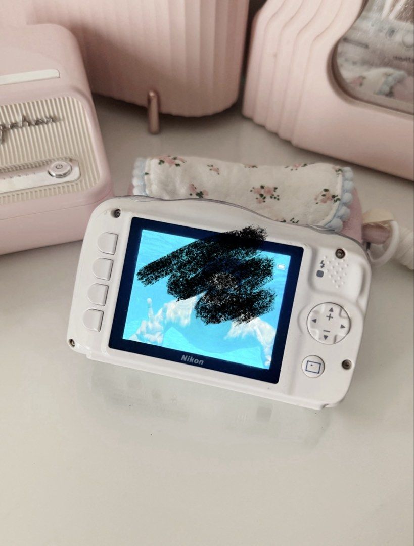 Nikon Coolpix S33 Digital Camera White Digicam Waterproof (Category: Cameras) located in Marilao. Submitted by toutlemonde (Listing ID 1460699924, Image 2). Description: - 13.2 MP CCD sensor - 3x glass zoom lens - can take photos and videos - 8/10 cosmetic condition - uses SD card (not included) - Waterproof down to 10 meters (33 feet), shock-proof (up to 1.5 meters, and freezeproof (-10*C) Issue: no functional issue Note: MY NEW FAV DIGICAM!! 🥹