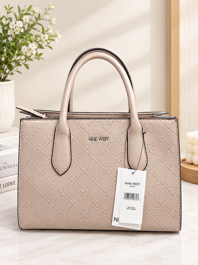 Nine West Alice Soft Marble Tote Bag (Category: Tote Bags) located in Manila. Submitted by melows08 (Listing ID 1460607182, Image 1). Description: - Nine West Alice tote bag - Soft marble color - All-over embossed pattern - Features top handles - Comes with original tag - Ideal for everyday use.