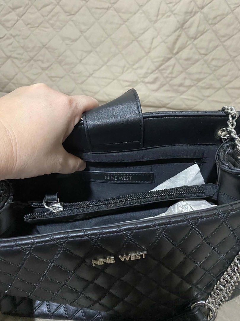 Nine West Black Quilted Chain Shoulder Bag (Category: Shoulder Bags) located in Pasig City. Submitted by bluejay23.water (Listing ID 1460656047, Image 2). Description: - Black quilted handbag from Nine West - Elegant silver chain straps - Interior zip pocket for essentials - Roomy main compartment - Flat bottom for easy standing - Ideal for everyday use - Meticulously cleaned inside and out RFS: Not using at all.