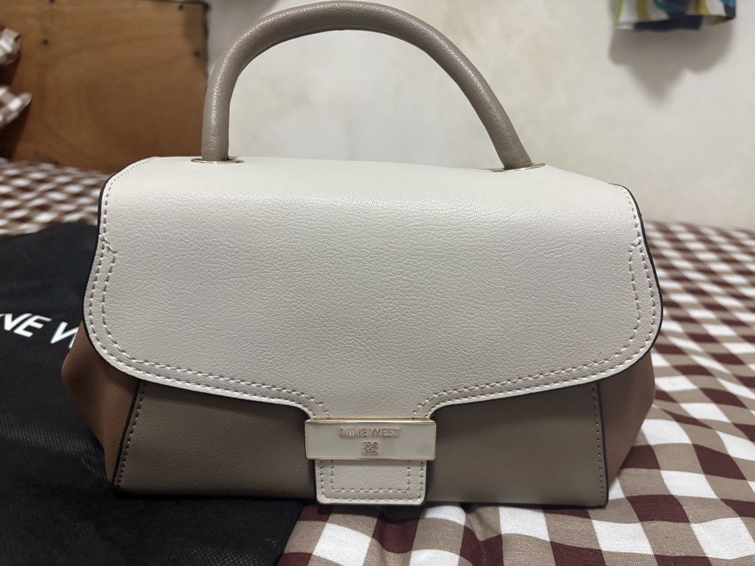 Nine West Sling Bag (Category: Cross-body Bags) located in Manila. Submitted by arenas.clang (Listing ID 1460669376, Image 1). Description: 👜 **FOR SALE: Almost New Nine West Sling Bag** ✨ Condition:Almost new / excellent condition 🛍️ Purchased: July 2026 via Nine West Flagship Store on Orange App 💰 Original Price:Around 4,000+ 🏷️ **Selling Price:2,000 — negotiable for a sure buyer Inclusions: • Sling bag with strap • Original dust bag • Orig