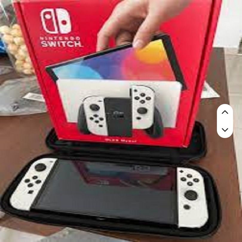 Nintendo Switch OLED Model White - Complete Set (Category: Nintendo) located in Caloocan City. Submitted by maryleis (Listing ID 1460529454, Image 1). Description: - Nintendo Switch OLED Model (White) - Includes original box and all accessories - Perfect for gaming on the go or at home - Comes with dock, Joy-Cons, and cables - Ready for a new owner.