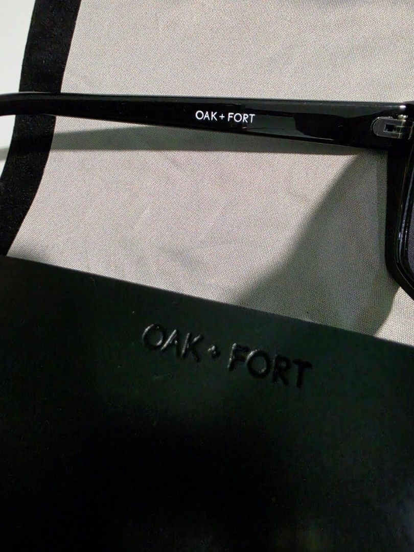 Oak + Fort Black Sunglasses with Case (Category: Sunglasses & Eyewear) located in Mandaluyong City. Submitted by decluttering.tita (Listing ID 1460584729, Image 3). Description: - Brand: Oak + Fort - Style: Black cat-eye sunglasses - Design: Unique angular shape - Includes: Black faux leather case with embossed logo, grey cleaning cloth - Details: Oak + Fort logo printed on temple.