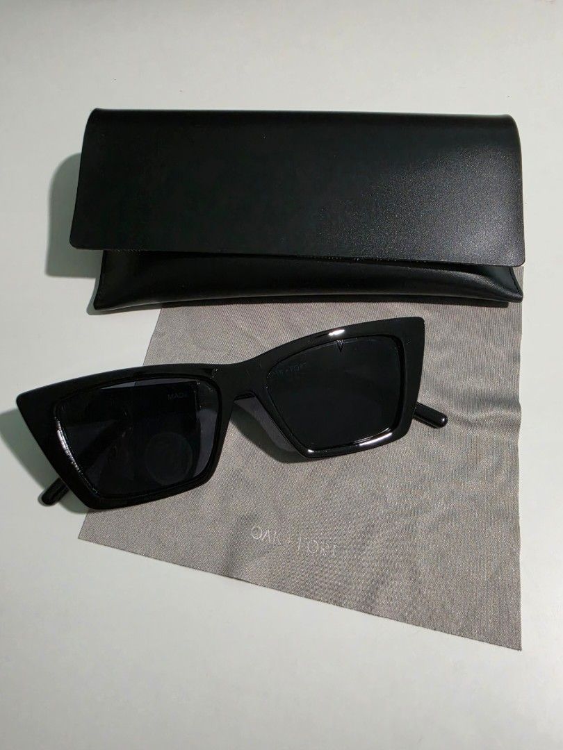 Oak + Fort Black Sunglasses with Case (Category: Sunglasses & Eyewear) located in Mandaluyong City. Submitted by decluttering.tita (Listing ID 1460584729, Image 1). Description: - Brand: Oak + Fort - Style: Black cat-eye sunglasses - Design: Unique angular shape - Includes: Black faux leather case with embossed logo, grey cleaning cloth - Details: Oak + Fort logo printed on temple.
