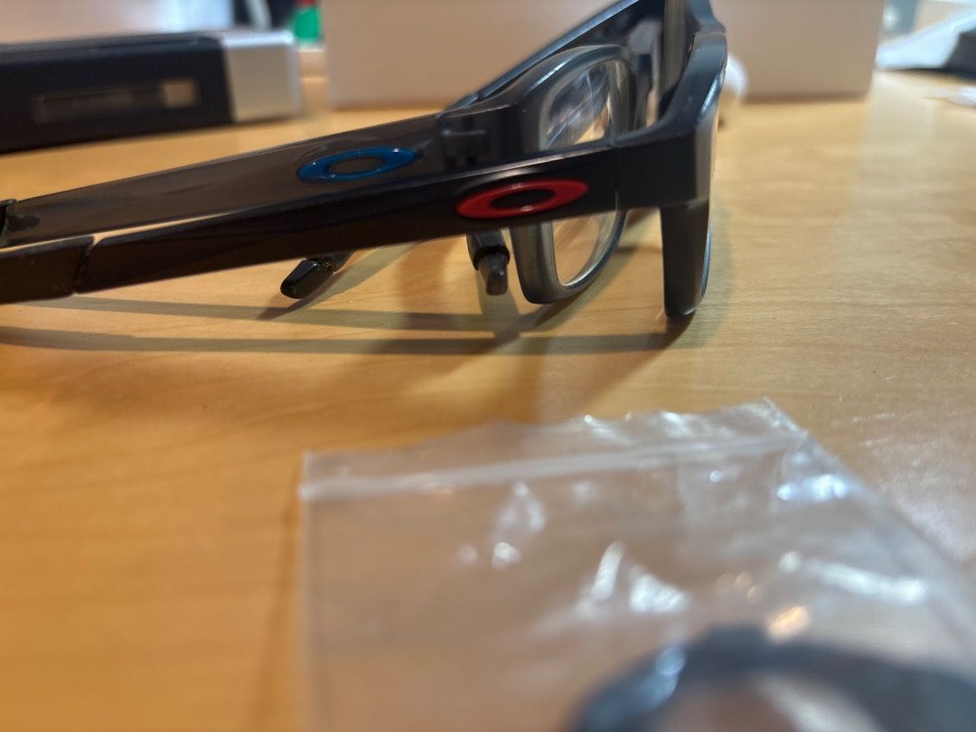 Oakley Chamfer Frames (Category: Sunglasses & Eyewear) located in Singapore. Submitted by rsimzy (Listing ID 1460636347, Image 2). Description: - Brand: Oakley - Model: Chamfer Frames (each $70 willing to nego) - Condition: Good, lenses can be removed for prescription lenses 2 Colours available , Grey and Black frames with interchangeable nose pads and “O” logo pieces .