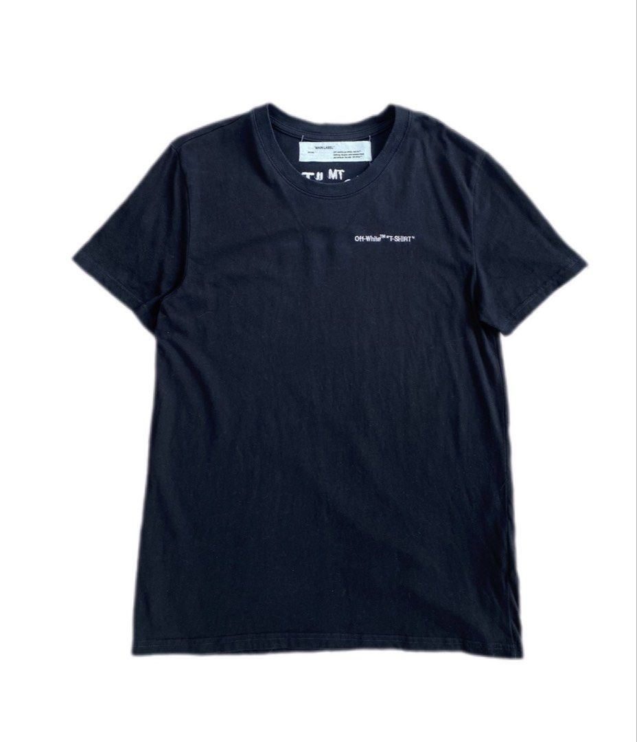 OFF-WHITE "T-SHIRT" Black Tee FW 2018-2019 (Category: Tshirts & Polo Shirts ) located in Maria Aurora. Submitted by archives767 (Listing ID 1460652313, Image 1). Description: - Authentic Black Off-White "T-SHIRT" tee - Features the classic Off-White logo prominently on the front - Back design includes "T-SHIRT" text and "Off-White c/o Virgil Abloh™ Fall Winter 2018-2019" details - A must-have addition to any streetwear enthusiast's collection - P