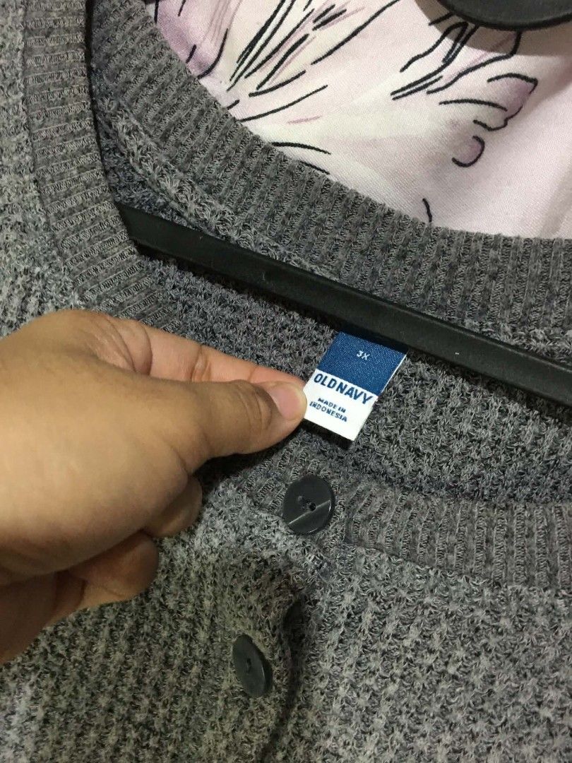 Old Navy Grey Waffle Knit Henley Sweater (Category: Coats, Jackets and Outerwear) located in Cavite. Submitted by jsmngrml18 (Listing ID 1460707870, Image 2). Description: - Brand: Old Navy - Color: Grey - Material: Waffle knit - Fit: Relaxed - Sleeves: Long - Neckline: Henley with 2 buttons - Style: Comfortable, casual, great for layering.