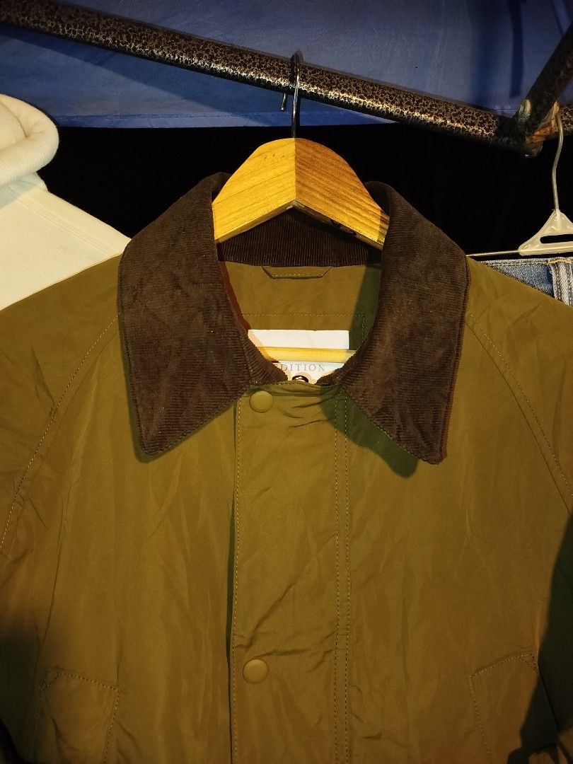 Olive Green Barbour Style Waxed Jacket (Category: Coats, Jackets and Outerwear) located in Manila. Submitted by warrenwarr65028 (Listing ID 1460655901, Image 2). Description: - Classic olive green jacket - Features a stylish corduroy collar detail - Two functional front pockets - Easy button-up closure - Ideal for layering - Versatile: pairs well with jeans or trousers - A timeless addition to any wardrobe.