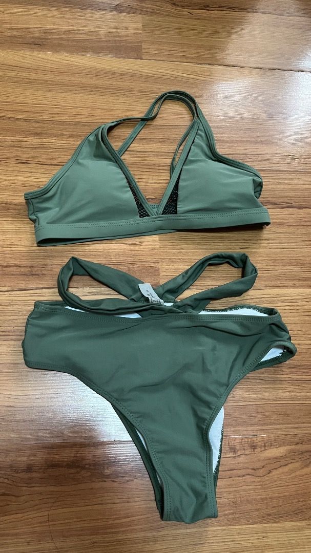 Olive Green Bikini Set with Mesh Detail (Category: Bikinis & Swimsuits) located in Taguig. Submitted by fayneayana (Listing ID 1460691768, Image 1). Description: - Olive green bikini set - Halter neck top with mesh detail at the bust - High-waisted bottoms with adjustable tie sides - Comfortable and stylish for any beach or pool occasion - Flattering fit.