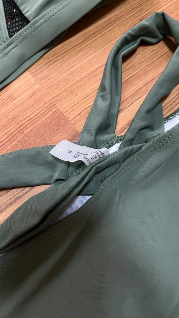 Olive Green Bikini Set with Mesh Detail (Category: Bikinis & Swimsuits) located in Taguig. Submitted by fayneayana (Listing ID 1460691768, Image 2). Description: - Olive green bikini set - Halter neck top with mesh detail at the bust - High-waisted bottoms with adjustable tie sides - Comfortable and stylish for any beach or pool occasion - Flattering fit.