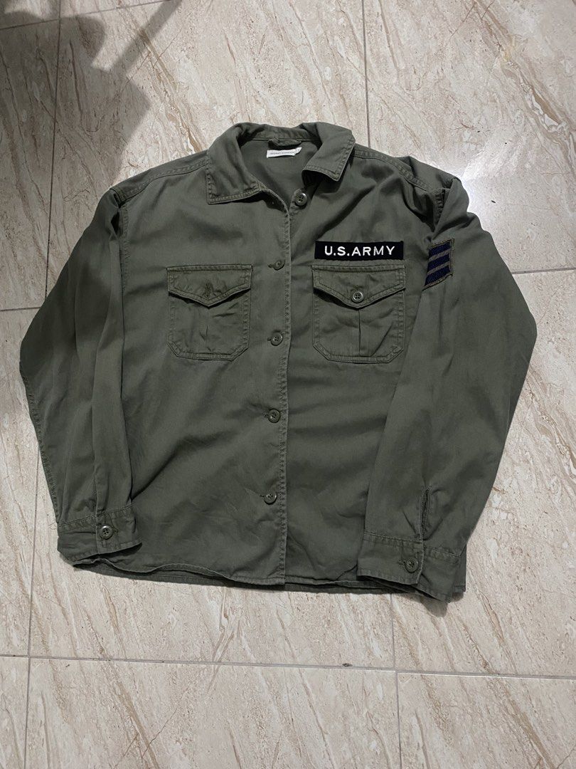 Olive Green U.S. ARMY Utility Shirt (Category: Tshirts & Polo Shirts ) located in Davao. Submitted by thriftarchive_dvo (Listing ID 1460690235, Image 1). Description: - Olive green utility shirt - Features U.S. ARMY patch on chest - Two front pockets with button closures - Button-up front and button cuffs - Classic military-inspired design - Perfect for a casual, rugged aesthetic.