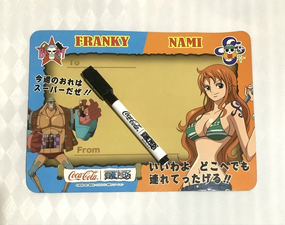 ONE PIECE x COCA-COLA WHITEBOARD (Category: Other Stationery & Craft) located in Talavera. Submitted by cattocollects (Listing ID 1460702050, Image 1). Description: Ahoy, fellow nakama! 🏴‍☠️ Get ready to set sail with this awesome One Piece x Coca-Cola whiteboard featuring the lovely Nami and the super-strong Franky! Perfect for jotting down your daily adventures, messages to your crew, or even your treasure map coordinates. It comes with a mark