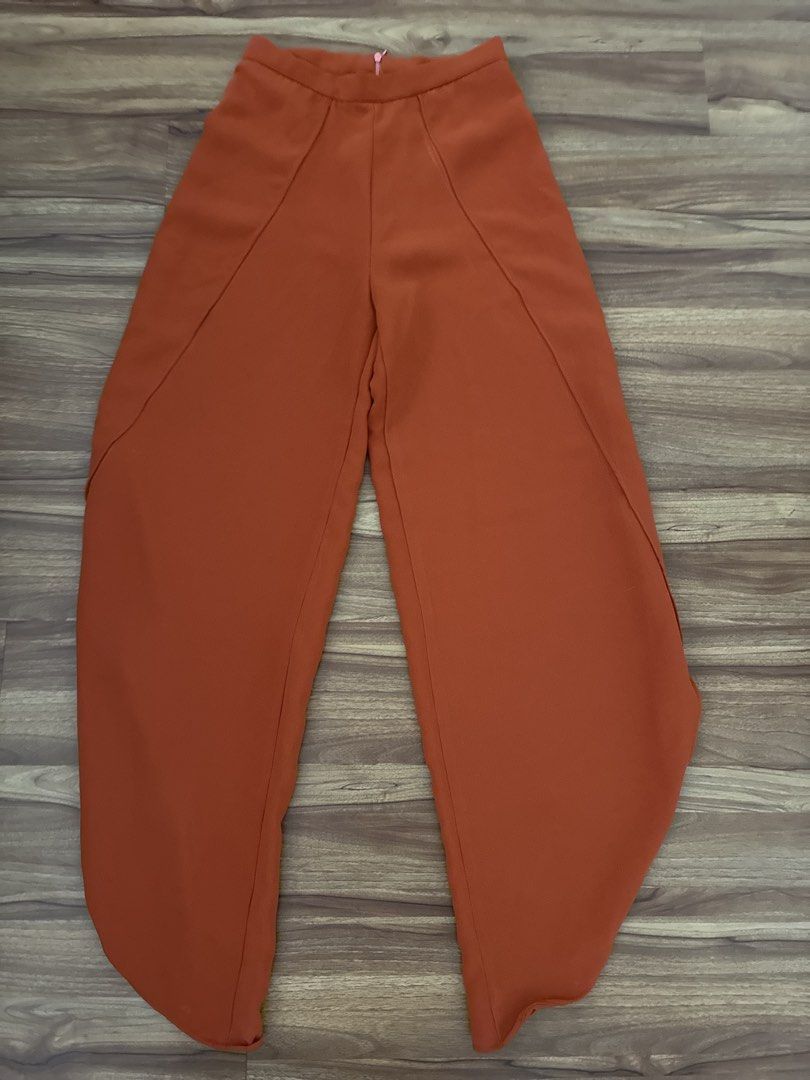 Orange Wide Leg pants (Category: Other Bottoms) located in Pasig City. Submitted by slr1949 (Listing ID 1460520692, Image 1). Description: - Trendy orange long pants - Unique paneling design - Wide leg silhouette - Flattering high-waisted fit - Convenient back zip closure - Fabric with a beautiful drape - Versatile: dress up or down.