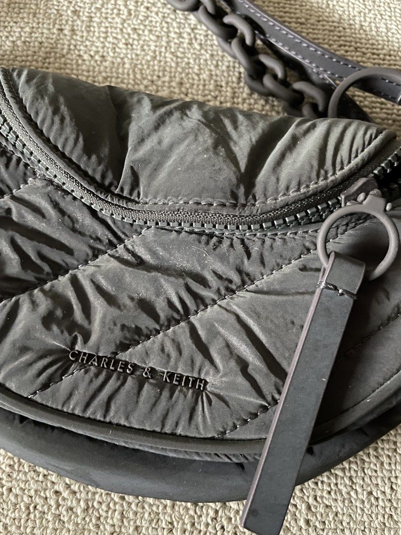 Orig Charles & Keith nylon two way bag (Category: Purses & Pouches) located in Caloocan City. Submitted by mdvs.bagsnmore (Listing ID 1460657075, Image 3). Description: Original Quilted nylon laser reflective material In excellent condition, no issue Still a preloved, limit your expectation Location: Caloocan north.