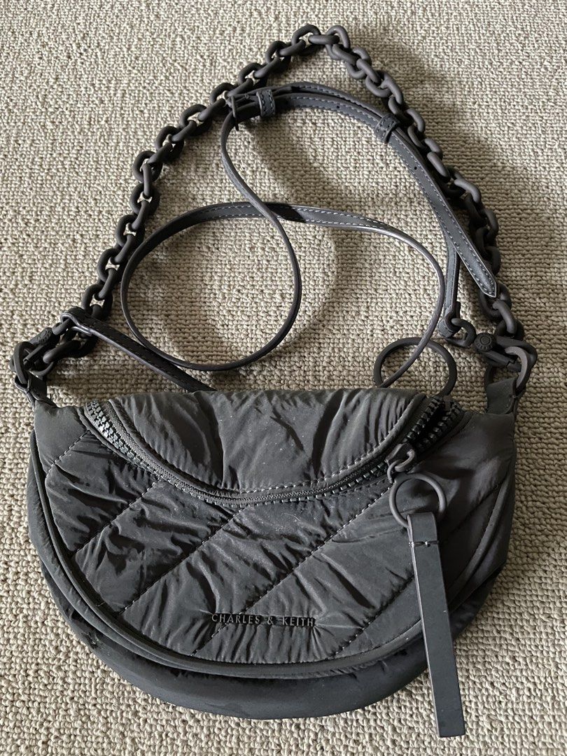 Orig Charles & Keith nylon two way bag (Category: Purses & Pouches) located in Caloocan City. Submitted by mdvs.bagsnmore (Listing ID 1460657075, Image 1). Description: Original Quilted nylon laser reflective material In excellent condition, no issue Still a preloved, limit your expectation Location: Caloocan north.