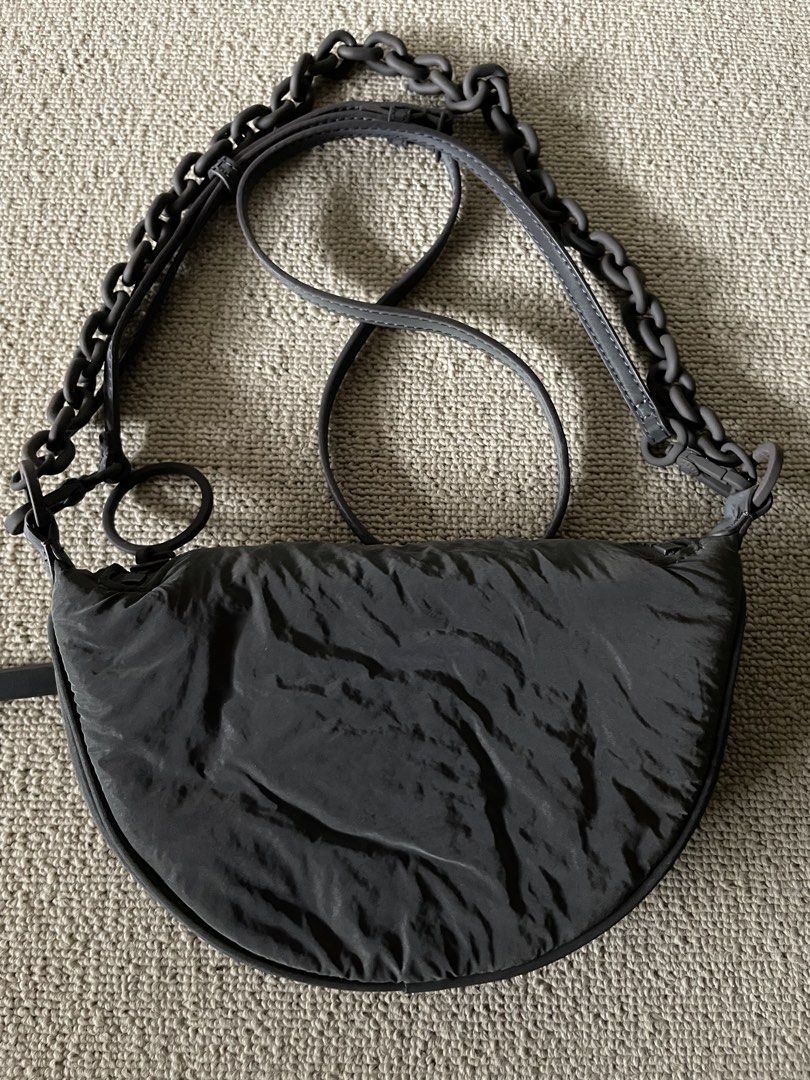 Orig Charles & Keith nylon two way bag (Category: Purses & Pouches) located in Caloocan City. Submitted by mdvs.bagsnmore (Listing ID 1460657075, Image 2). Description: Original Quilted nylon laser reflective material In excellent condition, no issue Still a preloved, limit your expectation Location: Caloocan north.