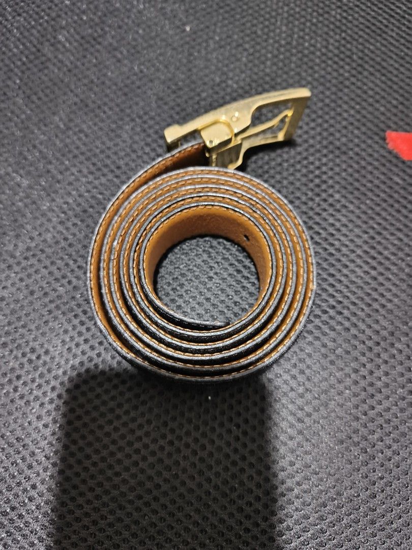 Original Ferre belt made in Italy (Category: Coats, Jackets and Outerwear) located in Tuguegarao City. Submitted by domzaiii (Listing ID 1460644936, Image 1). Description: There's a cut in the leather strap but it can be fixed.