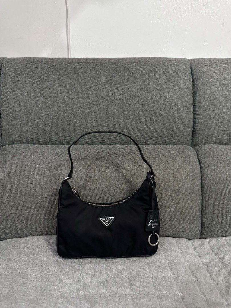 ORIGINAL Prada Re-Edition 2005 Nylon Shoulder Bag Black (Category: Luxury Bags & Wallets) located in Quezon City. Submitted by lovebyanne (Listing ID 1460707889, Image 1). Description: ORIGINAL PRADA 😍 - preloved and thrifted - 10/10 pristine condition - dm for more photos! - inclusions: only the bag - RFS: needs funds.