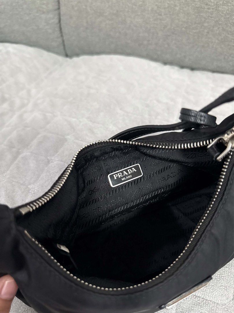 ORIGINAL Prada Re-Edition 2005 Nylon Shoulder Bag Black (Category: Luxury Bags & Wallets) located in Quezon City. Submitted by lovebyanne (Listing ID 1460707889, Image 2). Description: ORIGINAL PRADA 😍 - preloved and thrifted - 10/10 pristine condition - dm for more photos! - inclusions: only the bag - RFS: needs funds.