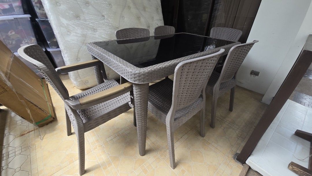 Outdoor dining patio set table (Category: Tables & Sets) located in Paranaque City. Submitted by lowwg (Listing ID 1460673414, Image 1). Description: Stylish 6-seater outdoor dining set with a sleek glass-top table and comfortable rattan-style chairs. Perfect for your patio or balcony. Ready for a new home! if interested message here Paranaque Area asking price 15k slightly negotiable.