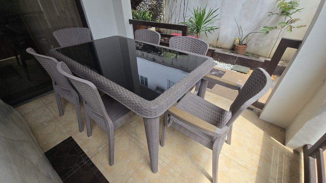 Outdoor dining patio set table (Category: Tables & Sets) located in Paranaque City. Submitted by lowwg (Listing ID 1460673414, Image 3). Description: Stylish 6-seater outdoor dining set with a sleek glass-top table and comfortable rattan-style chairs. Perfect for your patio or balcony. Ready for a new home! if interested message here Paranaque Area asking price 15k slightly negotiable.