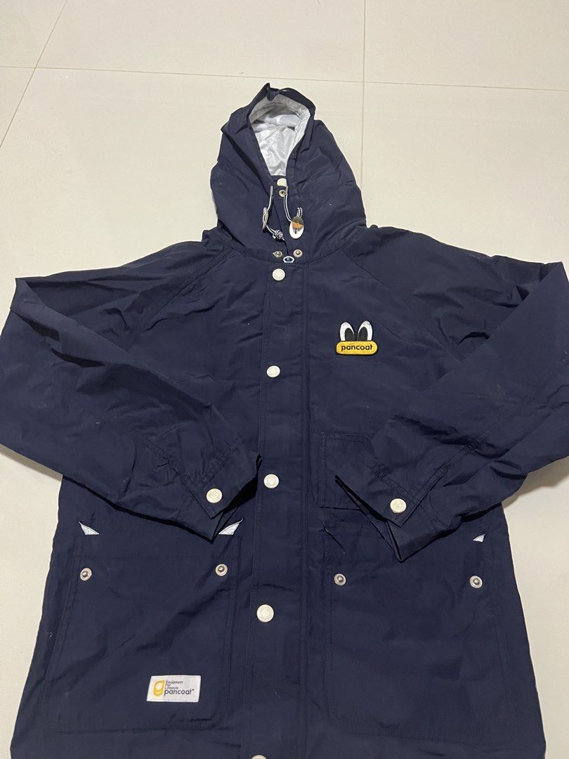 Pancoat Navy Blue Hooded Jacket (Category: Coats, Jackets and Outerwear) located in Lapu Lapu. Submitted by chelon.865 (Listing ID 1460701152, Image 1). Description: - Navy blue hooded jacket from Pancoat - Features iconic Pancoat character logo embroidered on the chest - Full button-up front - Two front pockets - White inner lining - Made in China - Ideal for casual wear.