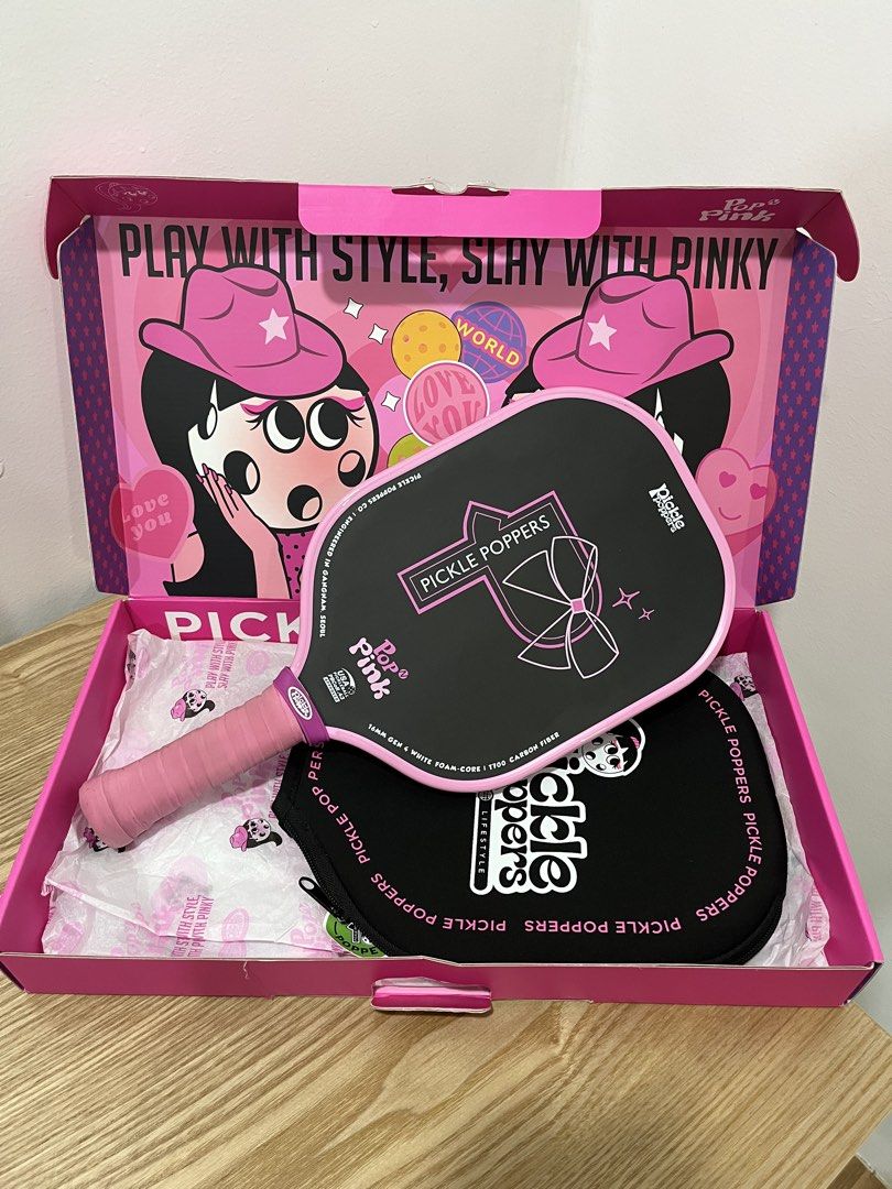 Pickle Poppers Pop N Pink (Category: Racket and Ball Sports) located in Davao. Submitted by beyondthebox_ (Listing ID 1460536092, Image 1). Description: For sale! Pickle Poppers Pop N Pink ✿ purchased during month of june ✿ with packaging box and paddle cover ✿ with free overgrip included ✿ rfs: quitting ✿ mop: gcash/bpi 💌 reply/dm to claim .