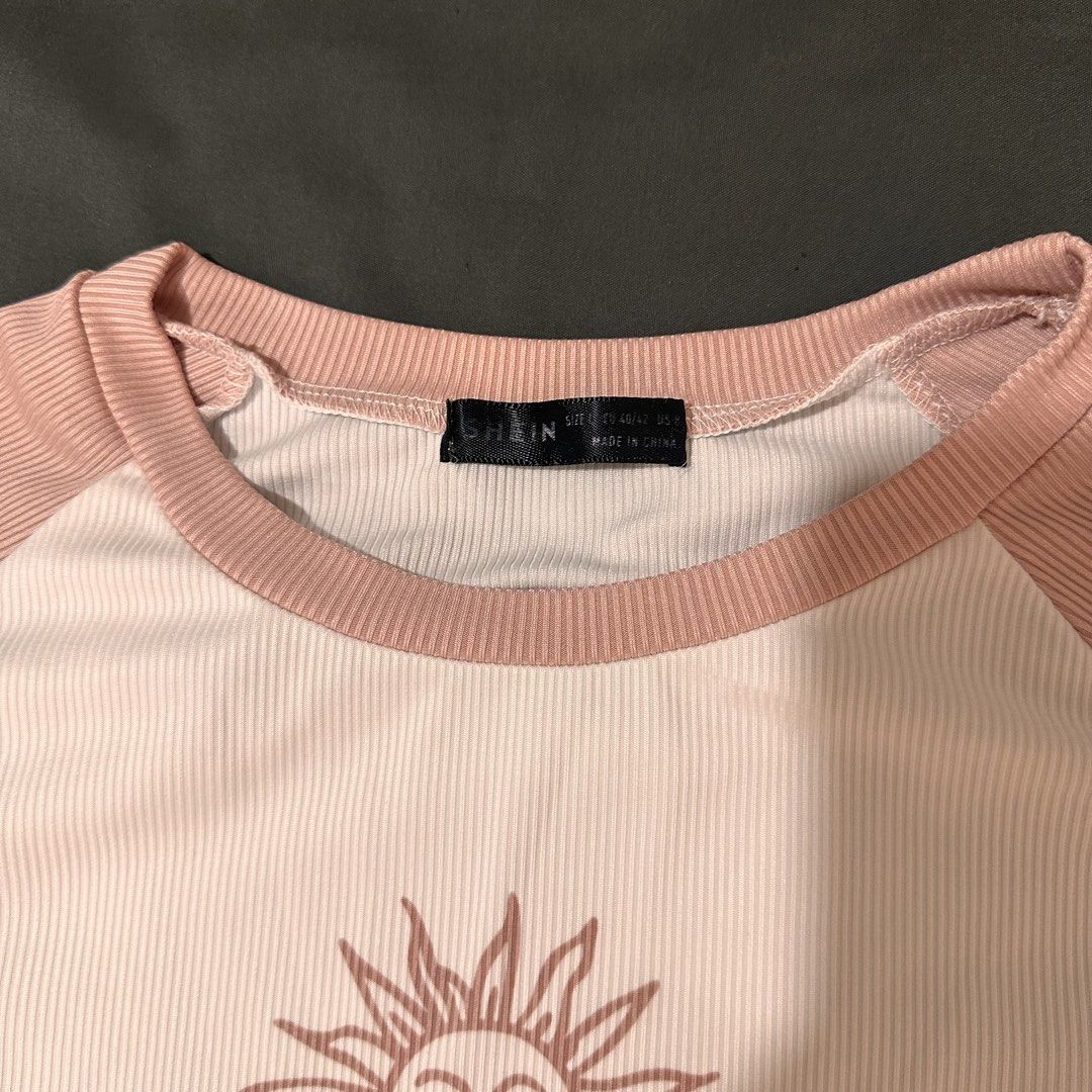 Pink and White Celestial Sun Graphic Raglan Crop Top (Category: Shirts) located in Manila. Submitted by andreidenise (Listing ID 1460582162, Image 2). Description: - doesn’t fit me anymore, 2020 era fr - l - xl ↶*ೃ✧˚. ❃ ↷ ˊ- location: taft ave. manila mop: gcash/bank transfer to gcash mod: j&t/lalamove/angkas ↶*ೃ✧˚. ❃ ↷ ˊ- * . °•★|•°∵r e m i n d e r s∵°•|☆•° . * ➺ no cod ➺ no return / refund / exchange ! I make sure that you’ll receive the correc