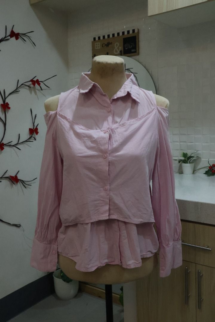 Pink Cold Shoulder Long Sleeve Blouse (Category: Blouses) located in Manila. Submitted by coolfalcon-bc48 (Listing ID 1460542294, Image 1). Description: - Cute pink blouse - Cold shoulder design - Long sleeves with buttoned cuffs - Button-up front - Peplum hem detail - Perfect for dressing up or down - Easy to pair with jeans or skirts.