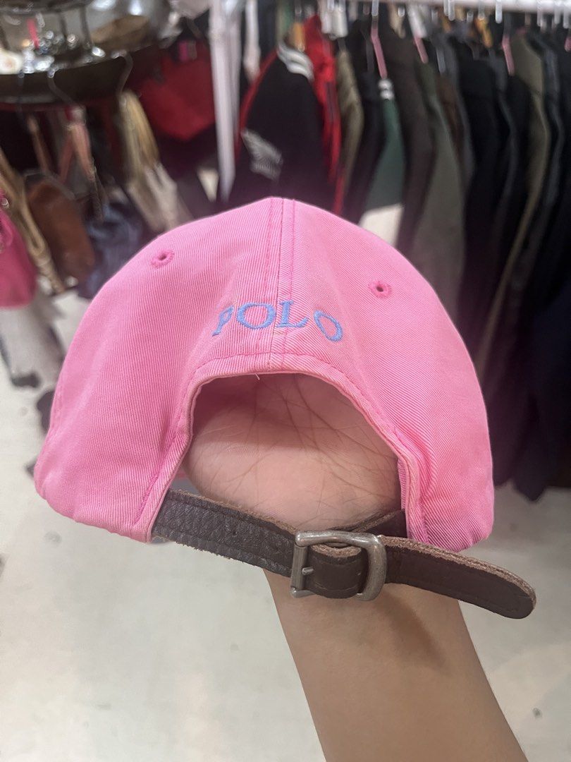 Pink Polo Ralph Lauren Cap (Category: Caps & Hats) located in Manila. Submitted by jortexxd (Listing ID 1460627872, Image 2). Description: - Classic pink baseball cap from Polo Ralph Lauren. - Features iconic light blue embroidered polo player logo on the front. - 'POLO' embroidered on the back. - Adjustable strap with buckle closure. - Made from 100% cotton. - One size fits most..