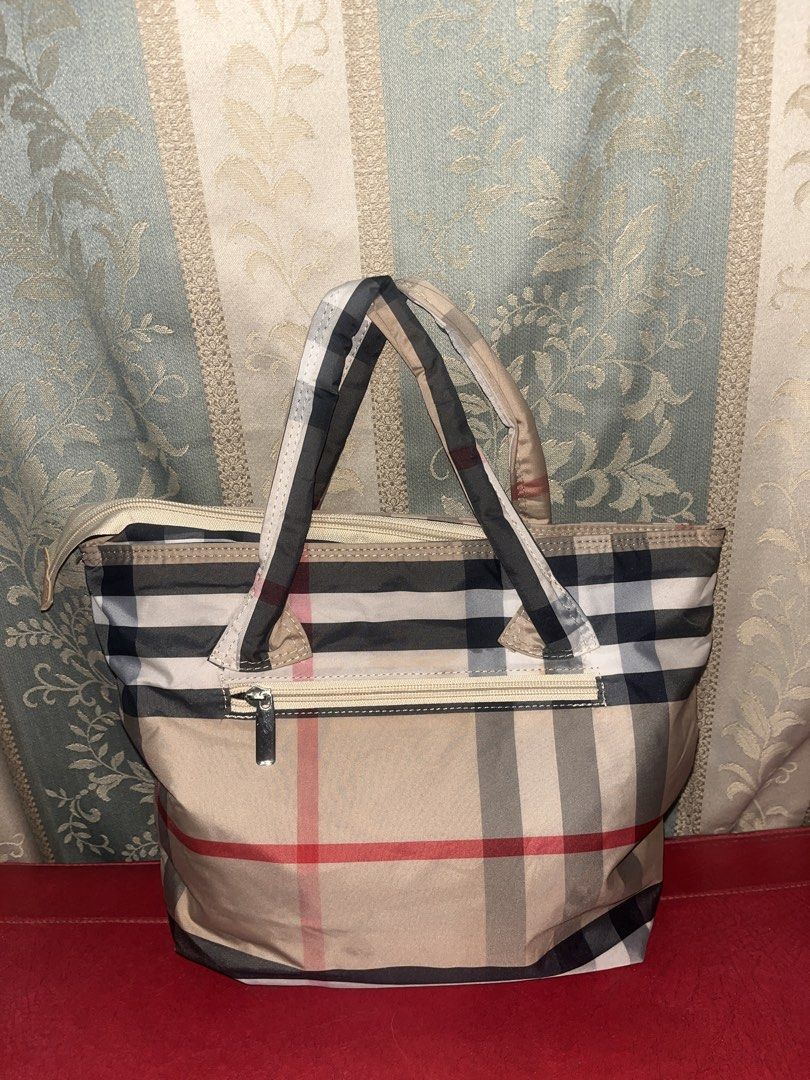 Plaid Cloud Tote bag (Category: Tote Bags) located in Davao. Submitted by janna_soleil (Listing ID 1460670436, Image 1). Description: beige plaid tote bag featuring a front zippered pocket and dual top handles.