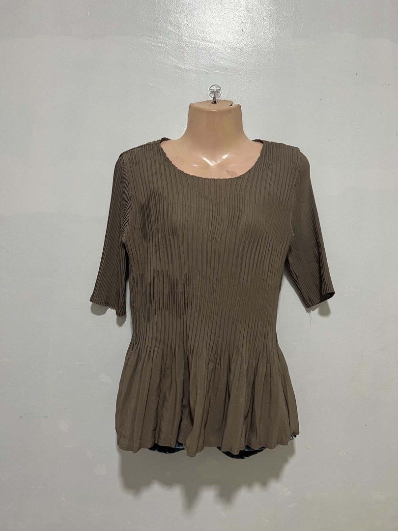 Pleatsme Pleated Top - Taupe (Category: Blouses) located in Oroquieta. Submitted by zjstg (Listing ID 1460643054, Image 1). Description: - Taupe color - Unique pleated design - Round neckline - 3/4 sleeves - Slightly flared hem - Brand: Pleatsme - Perfect for dressing up or down -Dimensions Ptp: 16” Length: 23” Excellent/No issue 200+sf .