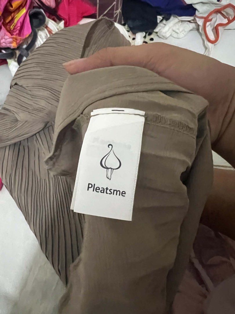 Pleatsme Pleated Top - Taupe (Category: Blouses) located in Oroquieta. Submitted by zjstg (Listing ID 1460643054, Image 2). Description: - Taupe color - Unique pleated design - Round neckline - 3/4 sleeves - Slightly flared hem - Brand: Pleatsme - Perfect for dressing up or down -Dimensions Ptp: 16” Length: 23” Excellent/No issue 200+sf .