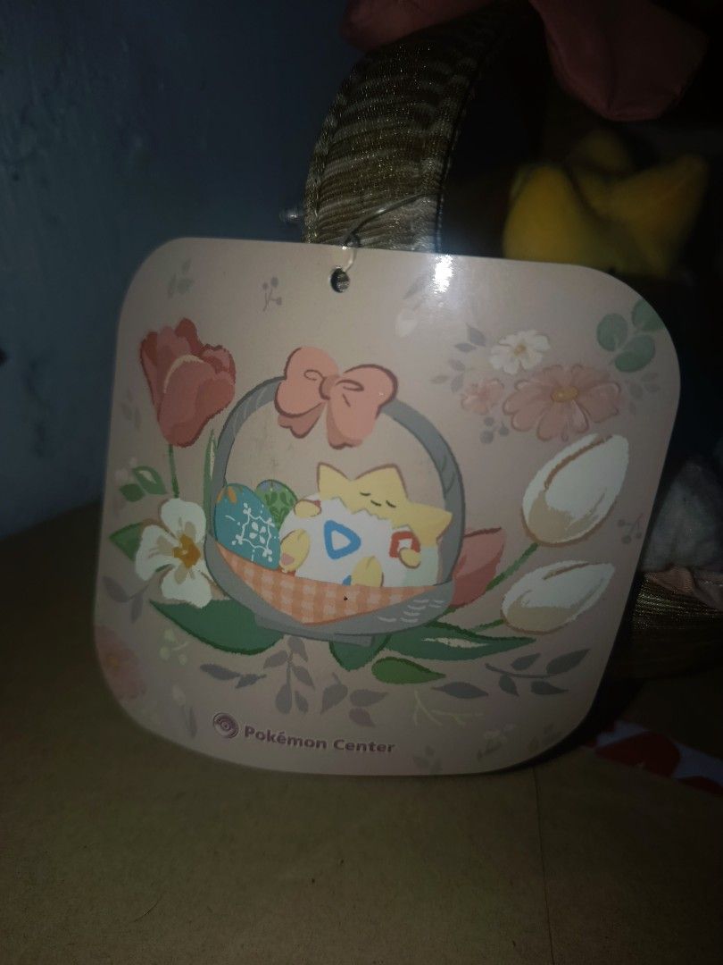 Pokemon Center Easter Togepi Plush Basket with Eggs (Category: Plushies & Soft Toys) located in Manila. Submitted by elyuniverseevee (Listing ID 1460578002, Image 2). Description: - Adorable Pokemon Center Easter basket - Features Togepi peeking out of an egg - Comes with decorative Easter eggs - Ideal for collectors and festive decoration - Perfect for Easter celebrations -Brand New With PaperTag.