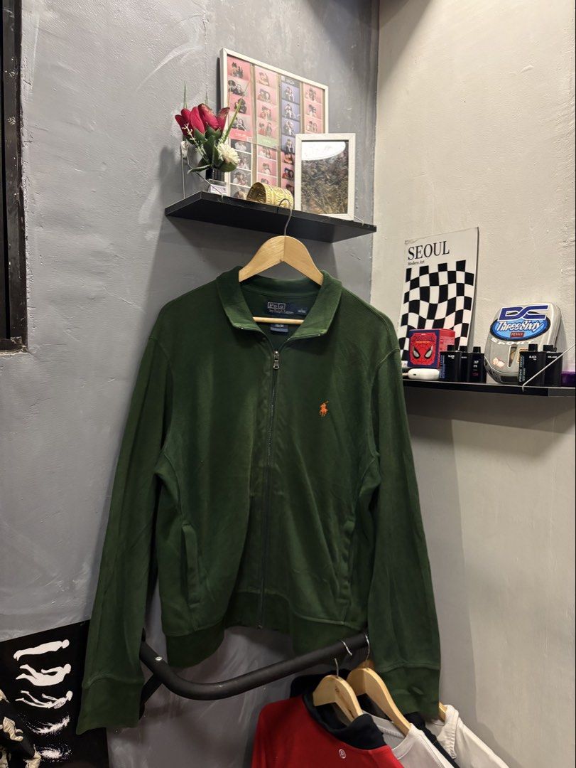 Polo by Ralph Lauren Green Zip-Up Jacket (Category: Coats, Jackets and Outerwear) located in Paranaque City. Submitted by mrthingsman (Listing ID 1460645983, Image 1). Description: Polo by Ralph Lauren Green Zip-Up Jacket 🧥 🌲 Size Large on tag🏷️ Dimension: •Width -22inches •Length -28inches Best fit Med to Xlarge Good size for men🫡 Great condition over all✨ Super Minimal discoloration.