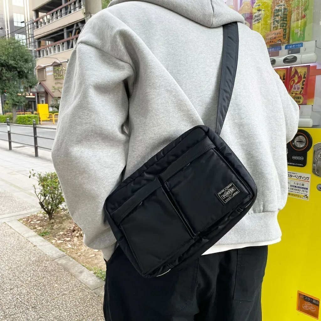 Porter Yoshida & Co. Shoulder Bag M (Category: Sling Bags) located in Antipolo. Submitted by bentakahitanoano (Listing ID 1460683018, Image 1). Description: The Porter-Yoshida & Co. Tanker Shoulder Bag is an iconic Japanese-made streetwear crossbody bag first introduced in 1983. Inspired by the U.S. Air Force MA-1 flight jacket, it is constructed using an original three-layer bonded fabric consisting of a nylon twill outer shell, a polyester cott