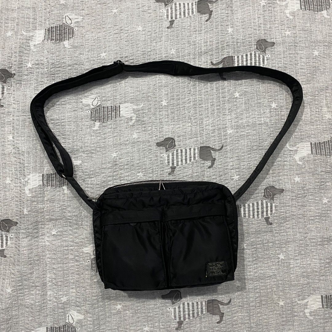 Porter Yoshida & Co. Shoulder Bag M (Category: Sling Bags) located in Antipolo. Submitted by bentakahitanoano (Listing ID 1460683018, Image 2). Description: The Porter-Yoshida & Co. Tanker Shoulder Bag is an iconic Japanese-made streetwear crossbody bag first introduced in 1983. Inspired by the U.S. Air Force MA-1 flight jacket, it is constructed using an original three-layer bonded fabric consisting of a nylon twill outer shell, a polyester cott