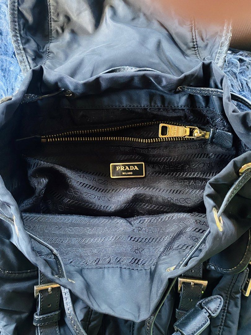 Prada backpack (Category: Backpacks) located in Solano. Submitted by CheapDealsCloset (Listing ID 1460538163, Image 3). Description: Prada backpack Nylon & leather material Lampo back zip / dollar sigh zip Beautiful .