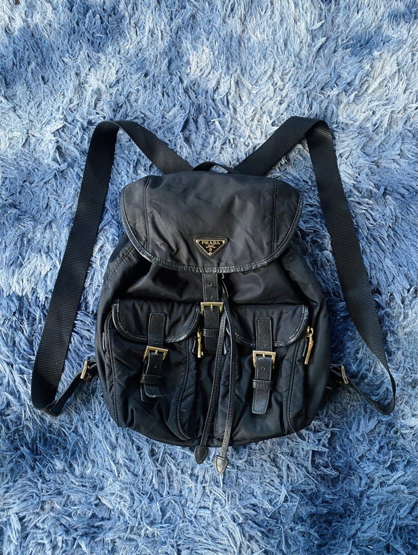 Prada backpack (Category: Backpacks) located in Solano. Submitted by CheapDealsCloset (Listing ID 1460538163, Image 1). Description: Prada backpack Nylon & leather material Lampo back zip / dollar sigh zip Beautiful .