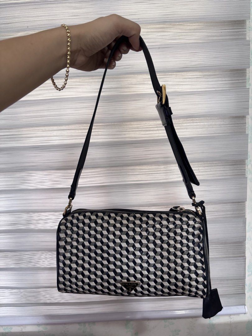 Prada black and white woven leather (Category: Luxury Bags & Wallets) located in Dagupan City. Submitted by raregrail.co (Listing ID 1460626494, Image 1). Description: .
